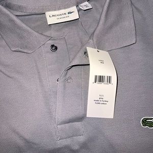 Lacoste Polo. Grey. Brand new with tags. Size Large.